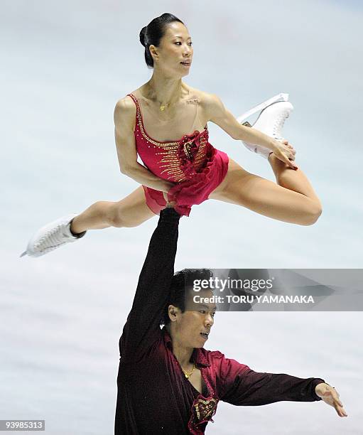 Chinese Zhao Hongbo lifts his partner Shen Xue during the free skating of the pair's competition in the figure skating ISU Grand Prix Final in Tokyo...