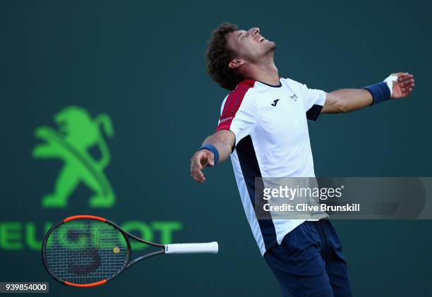 Pablo Carreno Busta of Spain celebrate smatch point against Kevin Anderson of South Africa in their quarterfinal during the Miami Open Presented by...