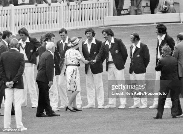 The Queen meets Dennis Lillee of Australia while being introduced to the Australian team by captain Ian Chappell and Gubby Allen during the 2nd Test...