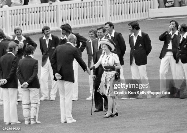 The Queen is introduced to England captain Tony Greig by MCC secretary Jack Bailey and Gubby Allen during the 2nd Test match between England and...