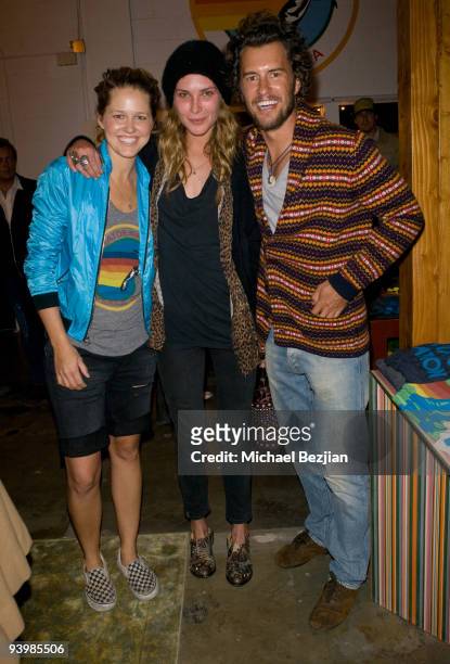 Store owner Paige Mycoskie, Erin Wasson, and founder of Toms shoes Blake Mycoskie attend the Aviator Nation flagship boutique opening on December 4,...