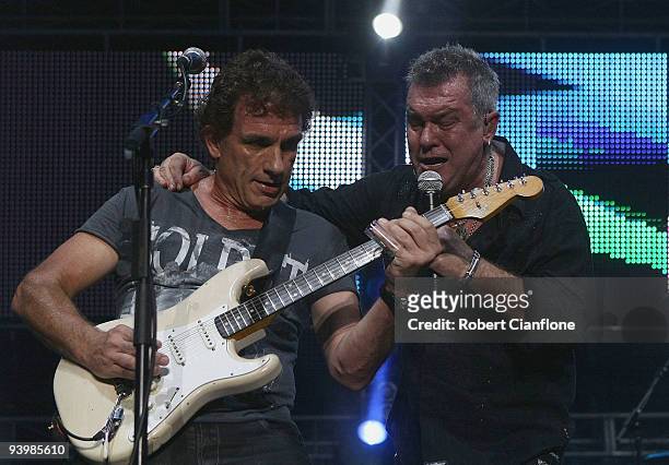 Ian Moss and Jimmy Barnes of Cold Chisel perform during a Cold Chisel concert at ANZ Stadium on December 5, 2009 in Sydney, Australia.