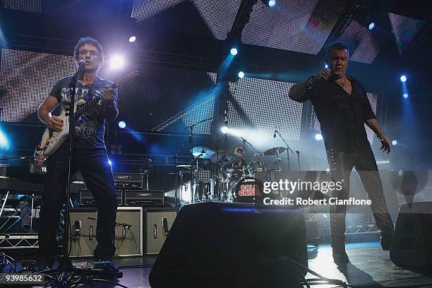 Ian Moss and Jimmy Barnes of Cold Chisel perform during a Cold Chisel concert at ANZ Stadium on December 5, 2009 in Sydney, Australia.