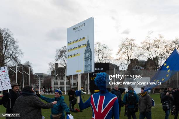 People gather in Parliament Square for an emergency demonstration on the anniversary of triggering Article 50. The rally, hosted by The Fair Vote...