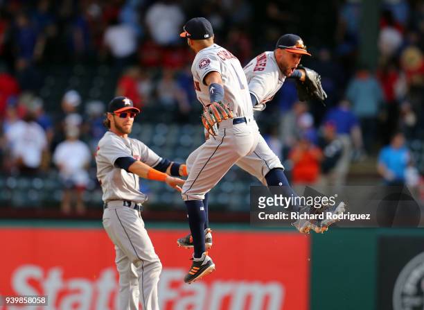 Josh Reddick, Carlos Correa, and George Springer of the Houston Astros celebrate the 4-1 win over the Texas Rangers at the Opening Day baseball game...