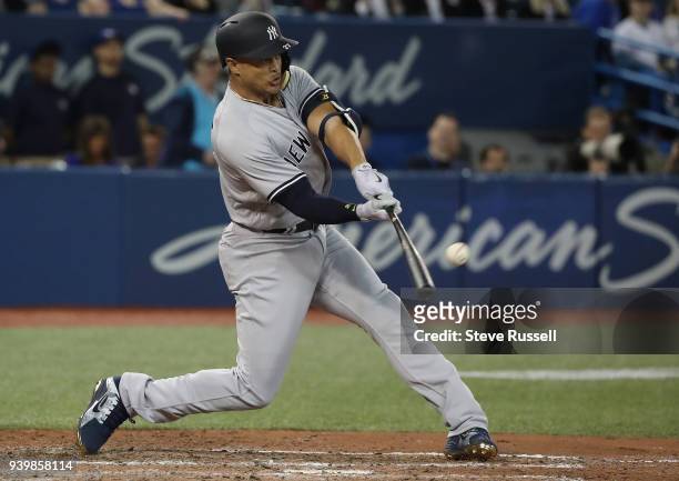 New York Yankees right fielder Giancarlo Stanton hits his second home run of the game as the Toronto Blue Jays open the season against the New York...