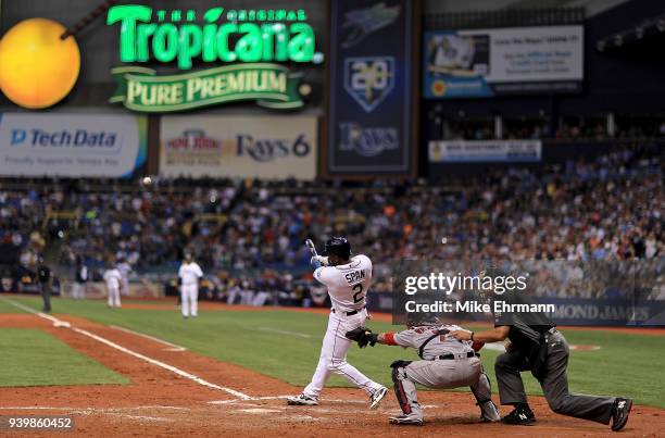 Denard Span of the Tampa Bay Rays hits a three run triple in the eighth inning during a game against the Boston Red Sox on Opening Day at Tropicana...