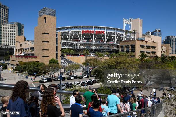 San Diego Padres fans walk to Petco Park on Opening Day between the Milwaukee Brewers and the San Diego Padres at PETCO Park on March 29, 2018 in San...