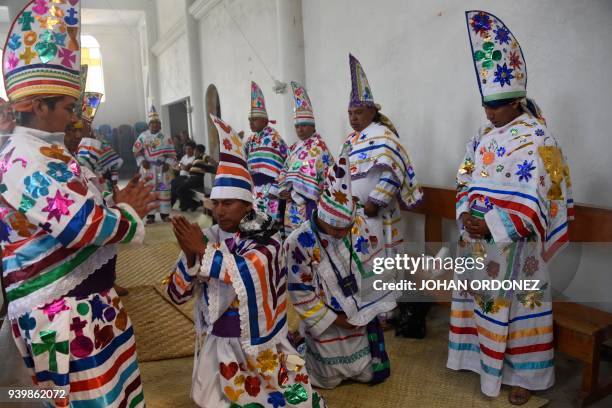 Group of indigenous men representing the 12 apostles get ready before the passage of Justo Juez procession within Holy Week celebrations, in...