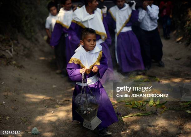 Indigenous catholic devotees take part in the Justo Juez procession within Holy Week celebrations, in Chinautla municipality 15 km north of Guatemala...