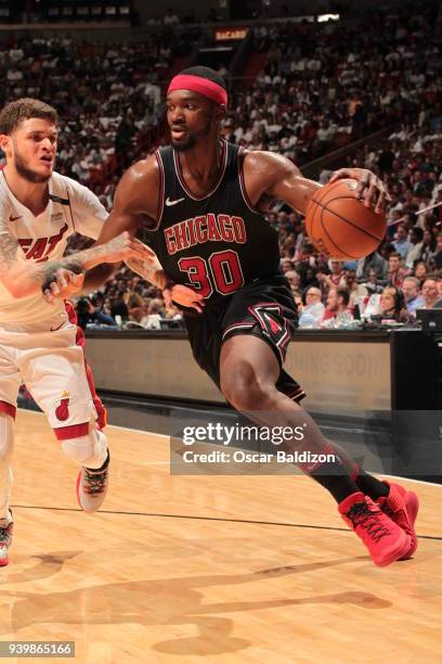 Noah Vonleh of the Chicago Bulls handles the ball against the Miami Heat on March 29, 2018 at American Airlines Arena in Miami, Florida. NOTE TO...