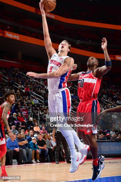 Luke Kennard of the Detroit Pistons goes to the basket against the Washington Wizards on March 29, 2018 at Little Caesars Arena in Detroit, Michigan....