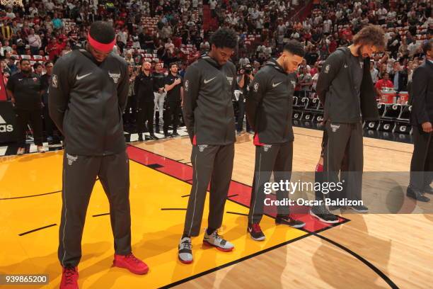 Denzel Valentine of the Chicago Bulls with his teammates stand for the National Anthem before the game against the Miami Heat on March 29, 2018 at...