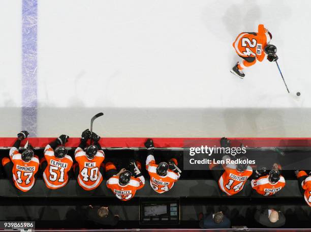 Matt Read of the Philadelphia Flyers skates the puck along the bench against the New York Rangers on March 22, 2018 at the Wells Fargo Center in...