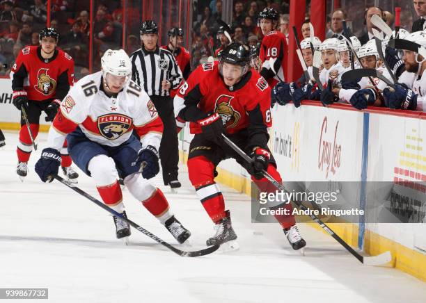 Mike Hoffman of the Ottawa Senators stickhandles the puck against Aleksander Barkov of the Florida Panthers at Canadian Tire Centre on March 29, 2018...