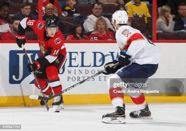 Ryan Dzingel of the Ottawa Senators stickhandles the puck against Alexander Petrovic of the Florida Panthers at Canadian Tire Centre on March 29,...