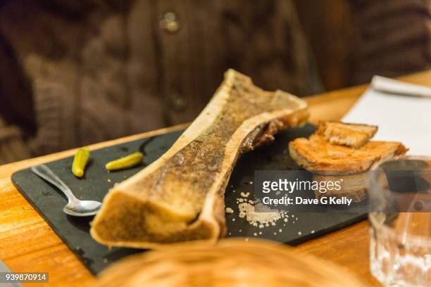 a portion of marrow bone on a plate - bone marrow stock pictures, royalty-free photos & images