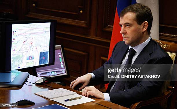 Russian President Dmitry Medvedev attends a video conference in connection with a fire in Perm's Lame Horse restaurant in Gorki outside Moscow on...
