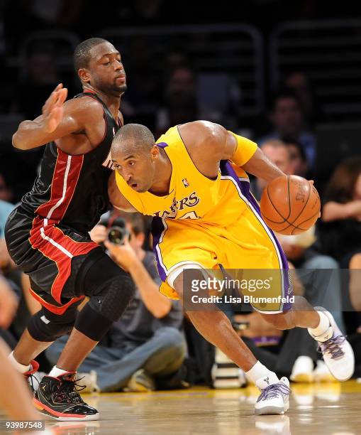 Kobe Bryant of the Los Angeles Lakers drives against Dwyane Wade of the Miami Heat at Staples Center on December 4, 2009 in Los Angeles, California....