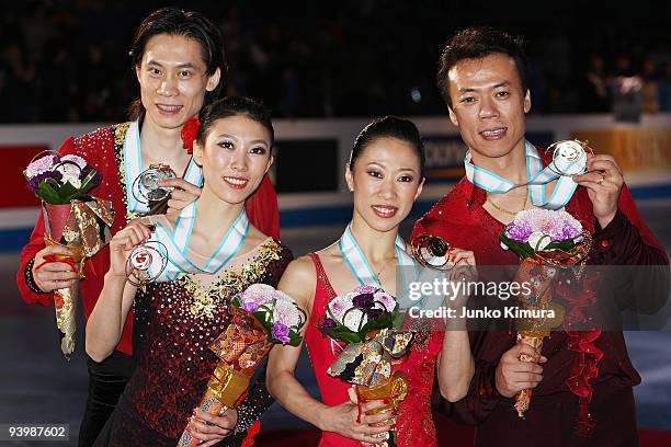 Winners Xue Shen and Hongbo Zhao of China and 2nd placed Qing Pang and Jian Tong of China pose with their medals after competing in the Pairs Free...