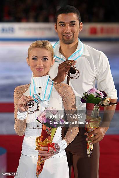 3rd placed Aliona Savchenko and Robin Szolkowy of Germany pose for photographs after competing in the Pairs Free Skating on the day three of ISU...