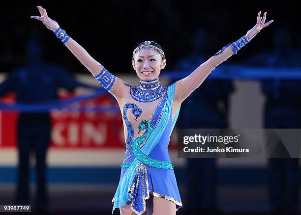 2nd placed Miki Ando of Japan greets the audience during the award ceremony on the day three of ISU Grand Prix of Figure Skating Final at Yoyogi...