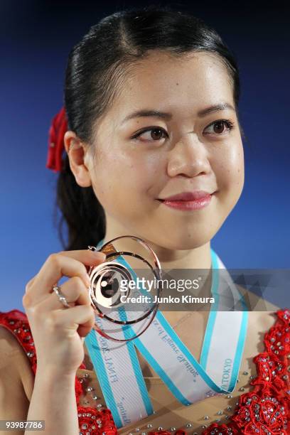 3rd placed Akiko Suzuki of Japan poses with her medal after competing in the Ladies Free Skating on the day three of ISU Grand Prix of Figure Skating...