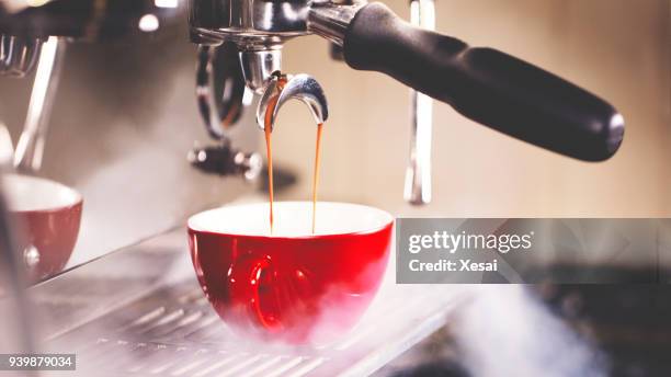 pulling a shot of espresso - coffee machine stock pictures, royalty-free photos & images