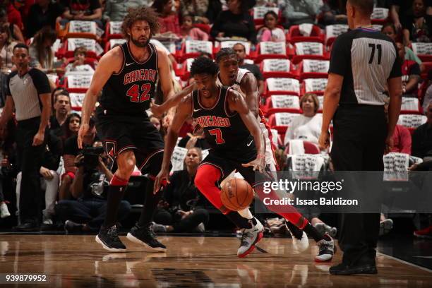 Justin Holiday of the Chicago Bulls handles the ball during the game against the Miami Heat on March 29, 2018 at American Airlines Arena in Miami,...