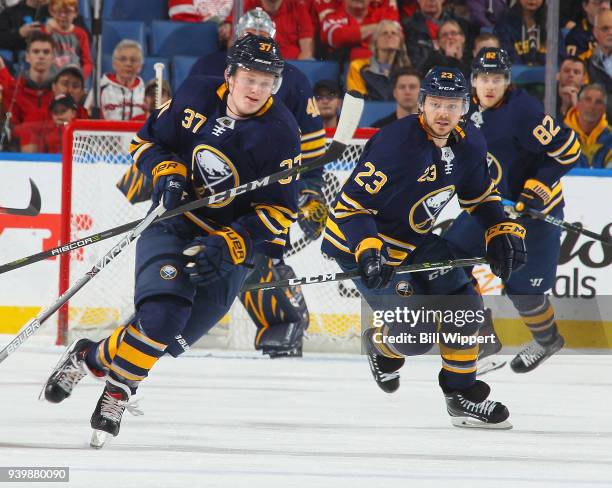 Casey Mittelstadt and Sam Reinhart of the Buffalo Sabres follow the play during an NHL game against the Detroit Red Wings on March 29, 2018 at...