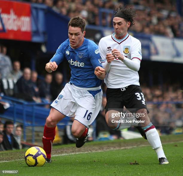 Steve Finnan of Portsmouth competes against Chris Eagles of Burnley during the Barclays Premier League match between Portsmouth and Burnley at...