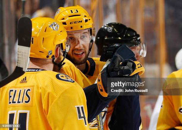 Nick Bonino talks with Ryan Ellis of the Nashville Predators as the waits for play to begin against the San Jose Sharks during an NHL game at...