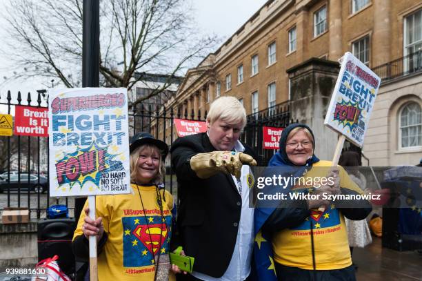 Boris Johnson impersonator Drew Miles and pro-EU supporters gather on Whitehall outside Downing Street in London for a 'EU Super Hero Vs. Brexit...