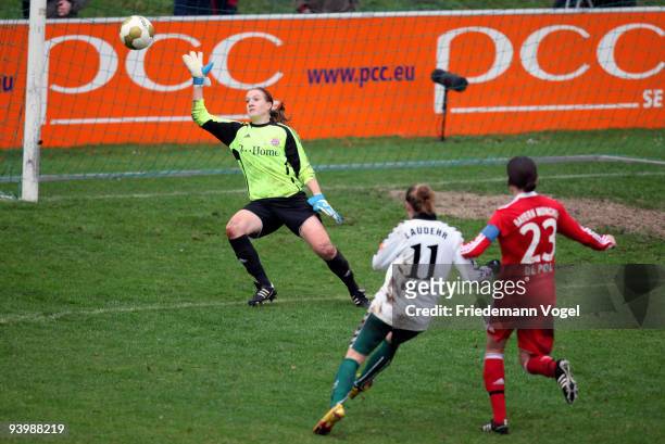 Simone Laudehr of Duisburg scores her team's third goal during the Women's Bundesliga match between FCR 2001 Duisburg and FC Bayern Muenchen at the...