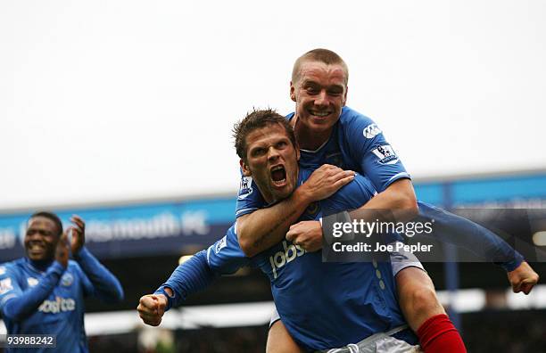 Hermann Hreidarsson of Portsmouth celebrates scoring the opening goal of the match during the Barclays Premier League match between Portsmouth and...