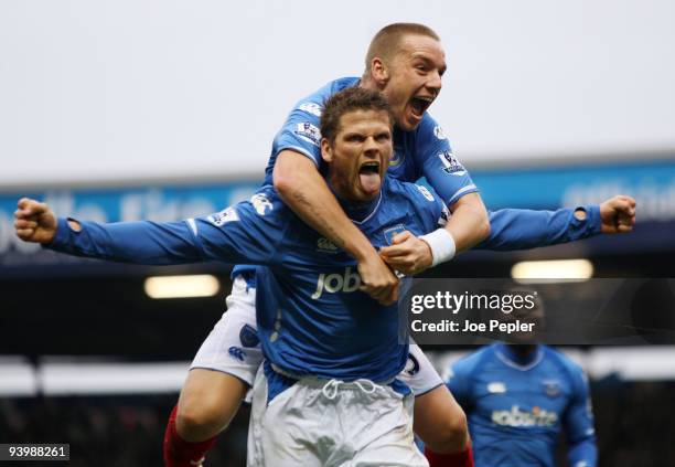 Hermann Hreidarsson of Portsmouth celebrates scoring the opening goal of the match during the Barclays Premier League match between Portsmouth and...