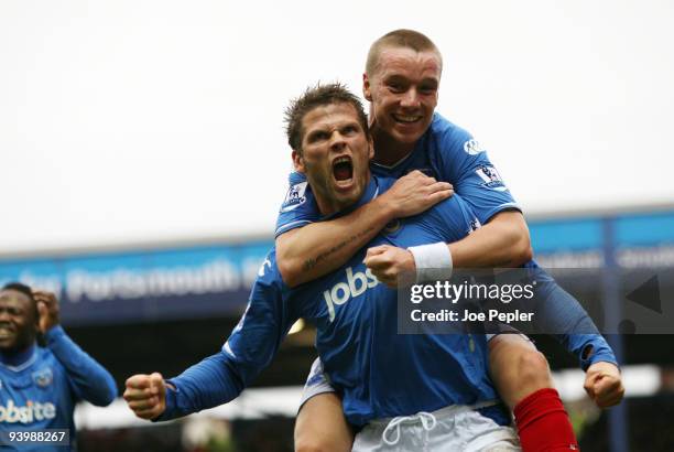 Hermann Hreidarsson of Portsmouth celebrates scoring the opening goal of the match during the Barclays Premier League match between Portsmouth and...