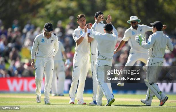 New Zealand bowler Trent Boult celebrates after dismissing Dawid Malan during day one of the Second Test Match between the New Zealand Black Caps and...