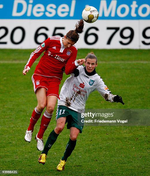 Stefanie Mirlach of Bayern in action with Simone Laudehr of Duisburg during the Women's Bundesliga match between FCR 2001 Duisburg and FC Bayern...