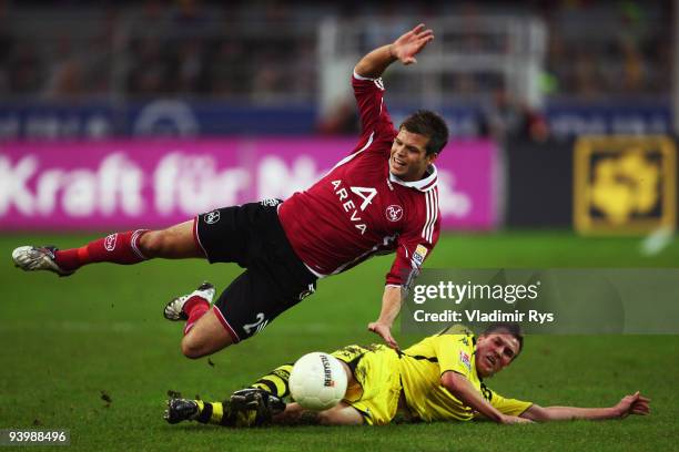 Kevin Grosskreutz of Dortmund fouls Dennis Diekmeier of Nuernberg during the Bundesliga match between Borussia Dortmund and 1. FC Nuernberg at Signal...