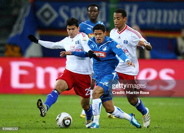 Tomas Rincon of Hamburg and Carlos Eduardo of Hoffenheim battle for the ball during the Bundesliga match between Hamburger SV and 1899 Hoffenheim at...