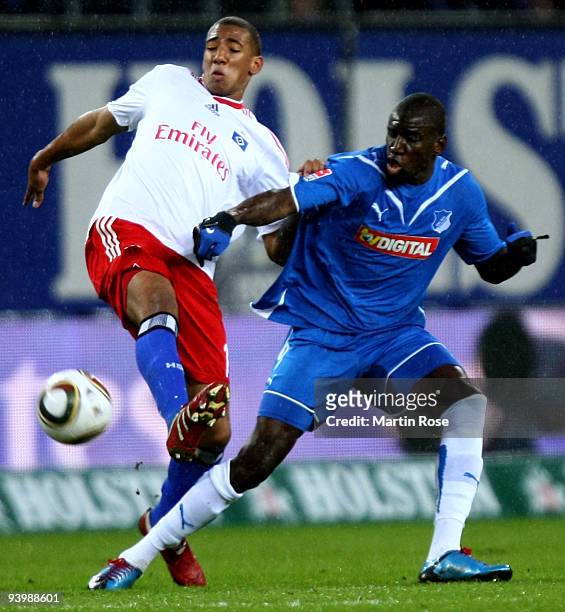 Jerome Boateng of Hamburg and Demba Ba of Hoffenheim battle for the ball during the Bundesliga match between Hamburger SV and 1899 Hoffenheim at the...