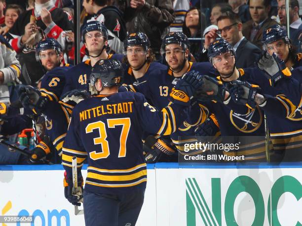 Casey Mittelstadt of the Buffalo Sabres celebrates his first NHL point picking up an assist in his first NHL game against the Detroit Red Wings on...