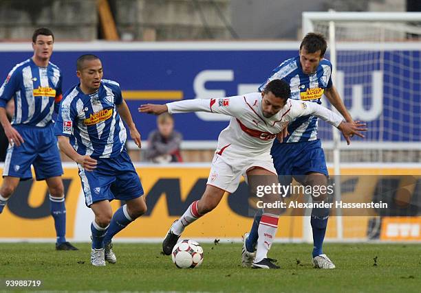 Elson of Stuttgart battles for the ball with Christoph Dabrowski of Bochum and his team mate Shinji Ono during the Bundesliga match between VfB...