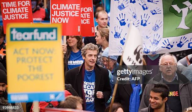 Scottish actor Peter Capaldi and television weather presenter Michael Fish join "The Wave" demonstration in support of action on climate change as it...
