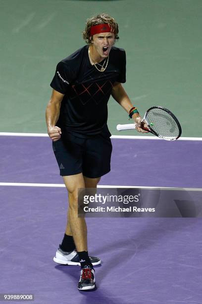 Alexander Zverev of Germany celebrates after defeating Borna Coric of Croatia in their quarterfinal match on Day 11 of the Miami Open Presented by...