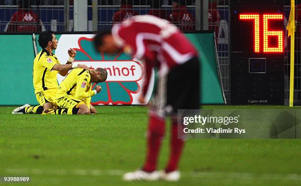 Mohamed Zidan celebrates with his team mate Lucas Barrios of Dortmund after scoring his team's third goal during the Bundesliga match between...