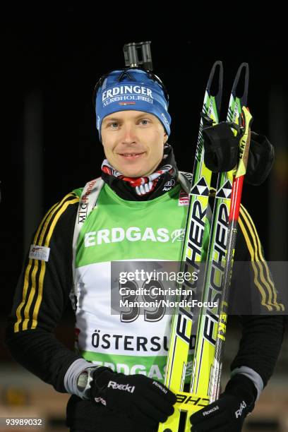 Andreas Birnbacher of Germany during the Flower Ceremony after the Men's 10 km Sprint the E.ON Ruhrgas IBU Biathlon World Cup on December 5, 2009 in...