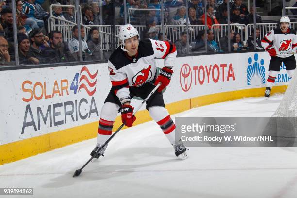 Ben Lovejoy of the New Jersey Devils skates with the puck against the San Jose Sharks at SAP Center on March 20, 2018 in San Jose, California. Ben...