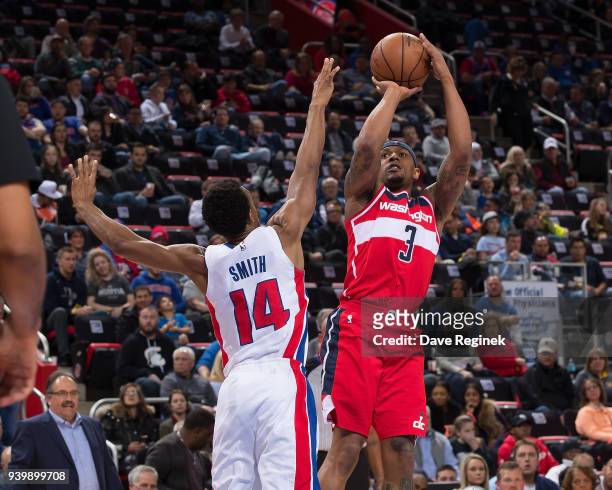 Bradley Beal of the Washington Wizards shoots the ball over Ish Smith of the Detroit Pistons during an NBA game at Little Caesars Arena on March 29,...